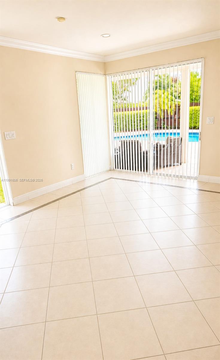 15615 Southwest 42nd Terrace Miami, FL 33185 - Photo 8 of 28 a view of a porch with a floor to ceiling window