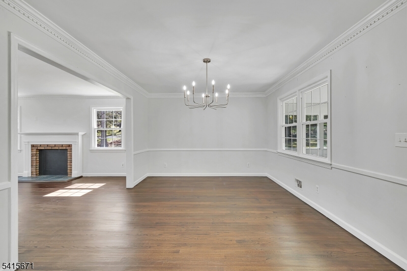 54 Robin Glen Road Watchung, NJ 07069 - Photo 11 of 42 a view of an empty room with window and wooden floor