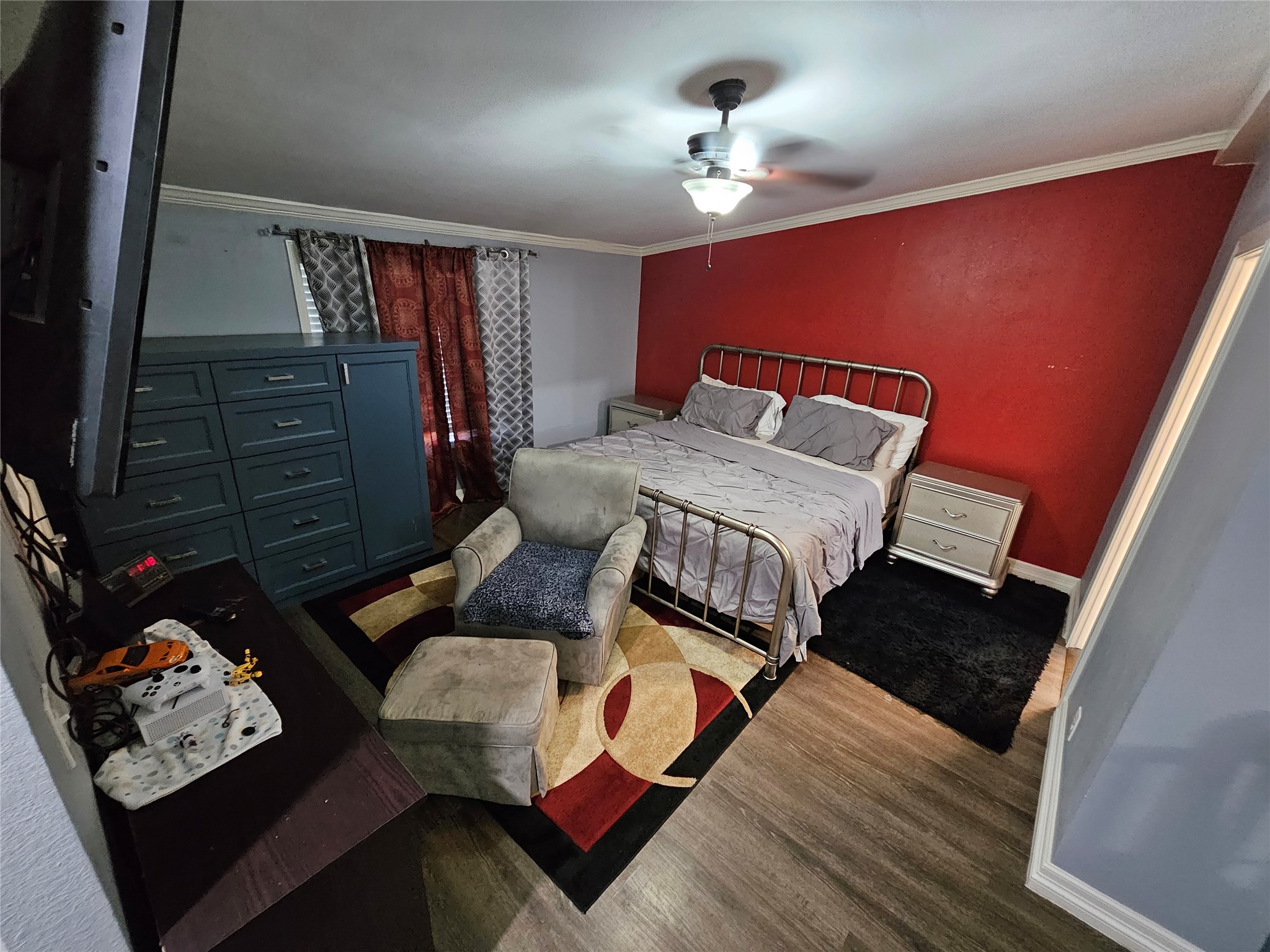 16313 Sandy View Drive Conroe, TX 77303 - Photo 11 of 41 a bedroom with furniture and a wooden floor