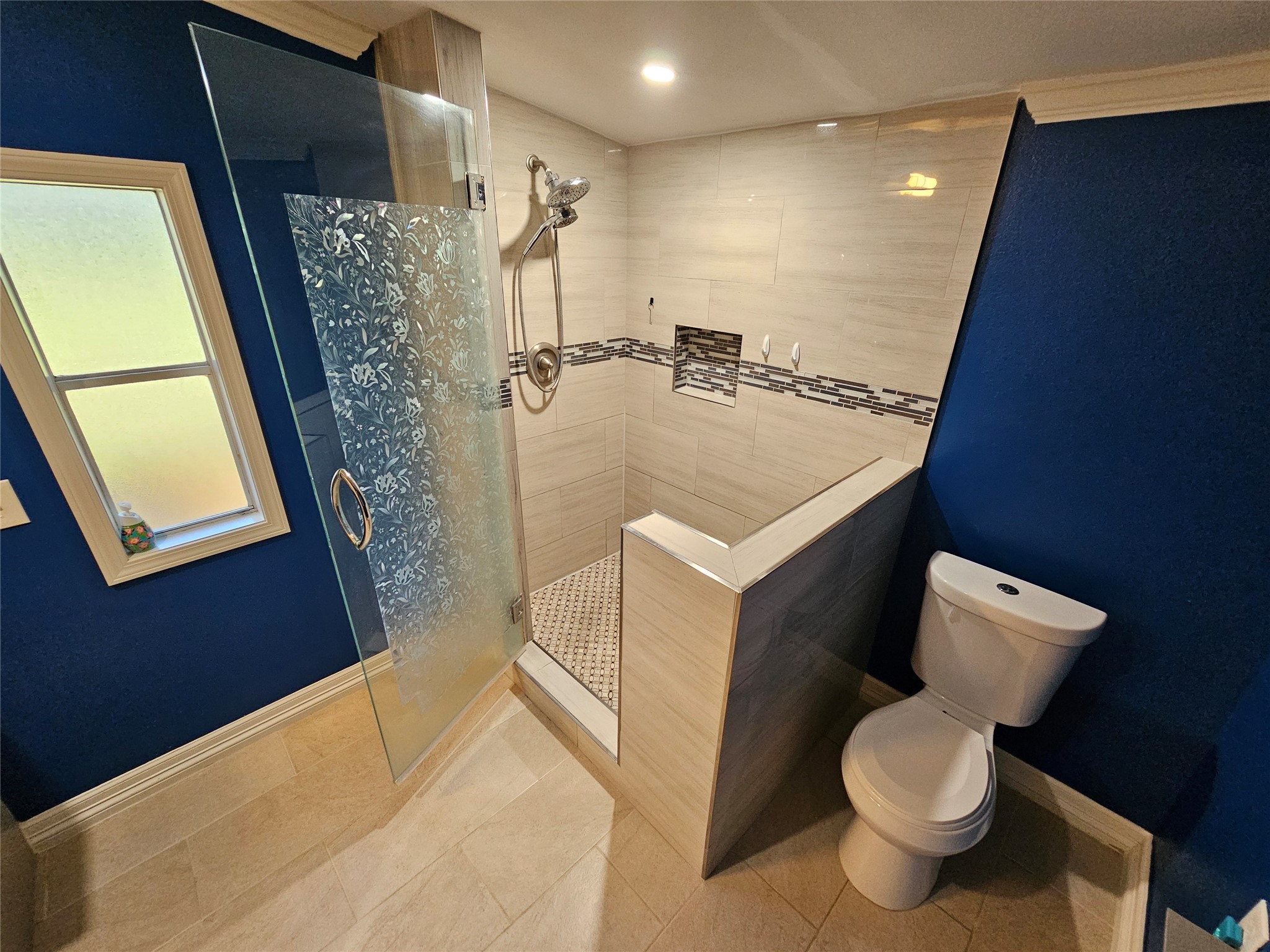 16313 Sandy View Drive Conroe, TX 77303 - Photo 17 of 41 a bathroom with a toilet sink and mirror