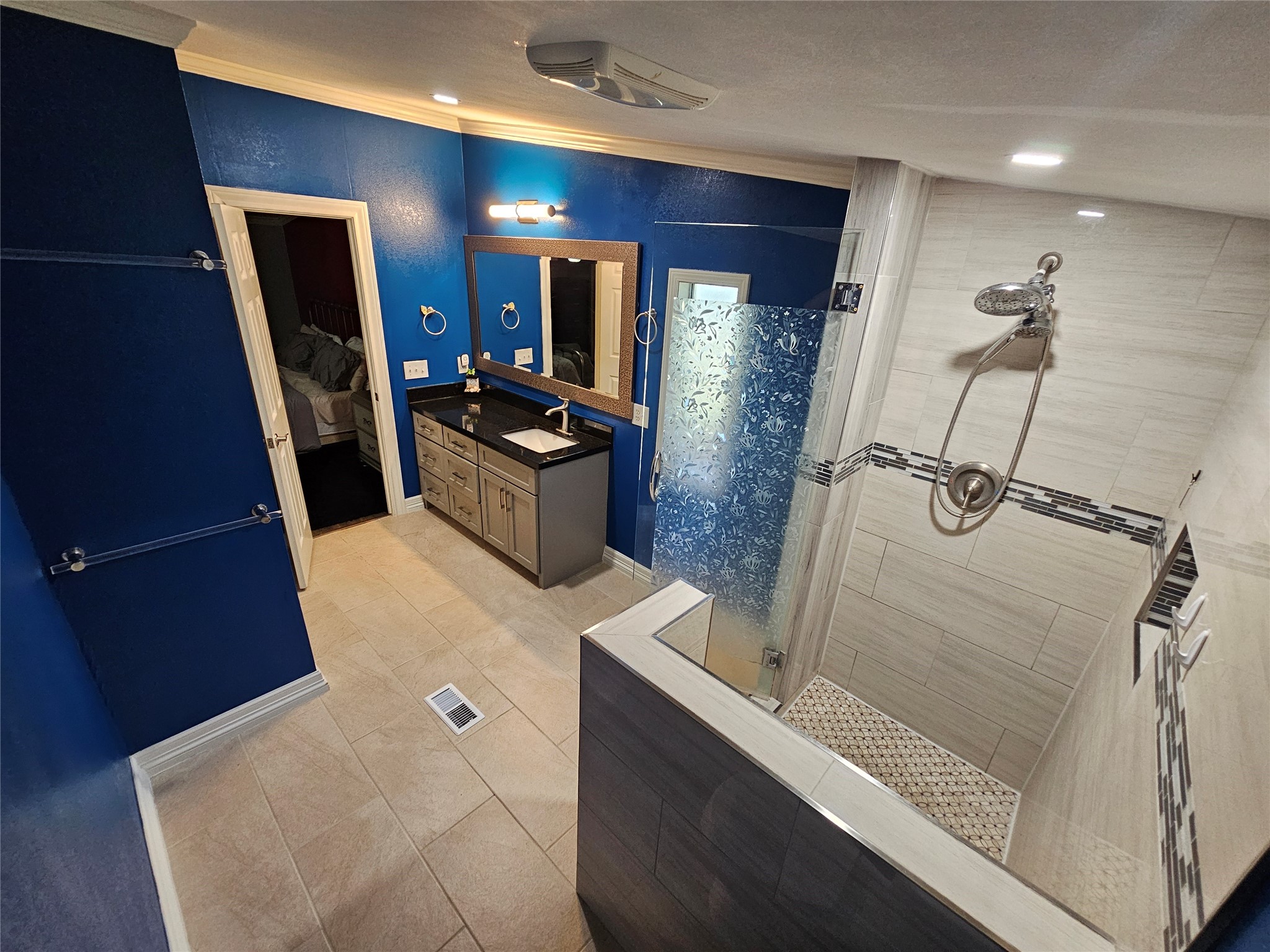 16313 Sandy View Drive Conroe, TX 77303 - Photo 18 of 41 a bathroom with a sink a vanity and mirror
