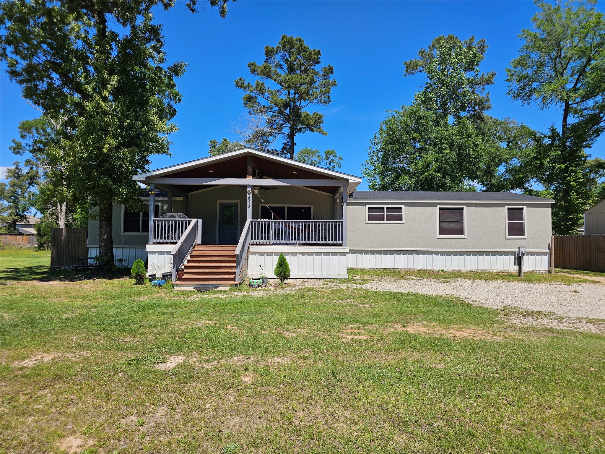 16313 Sandy View Drive Conroe, TX 77303 - Photo 2 of 41 a view of a house with a yard