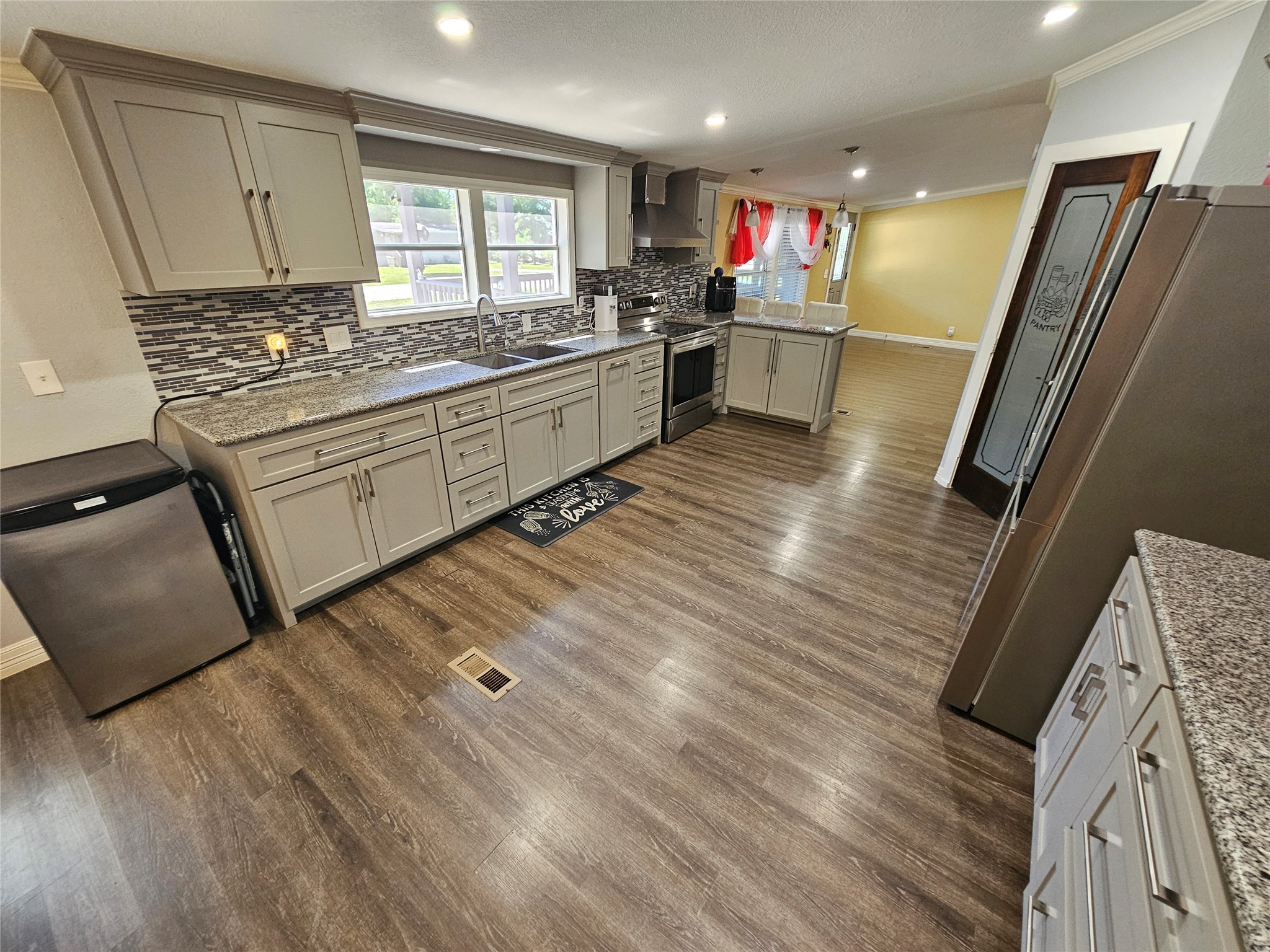 16313 Sandy View Drive Conroe, TX 77303 - Photo 22 of 41 a kitchen with a sink appliances and cabinets