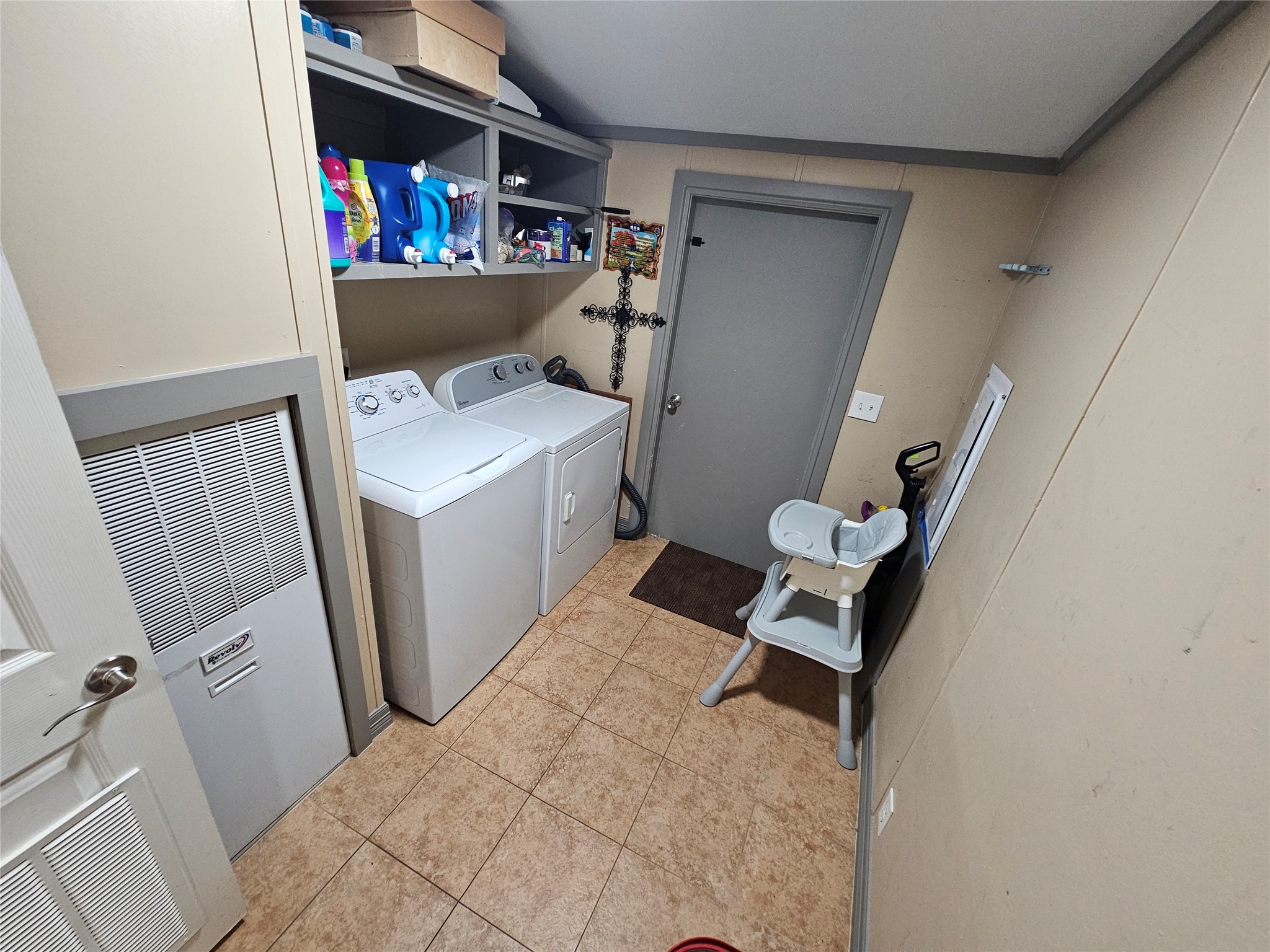 16313 Sandy View Drive Conroe, TX 77303 - Photo 30 of 41 a view of a storage and utility room with washer and dryer
