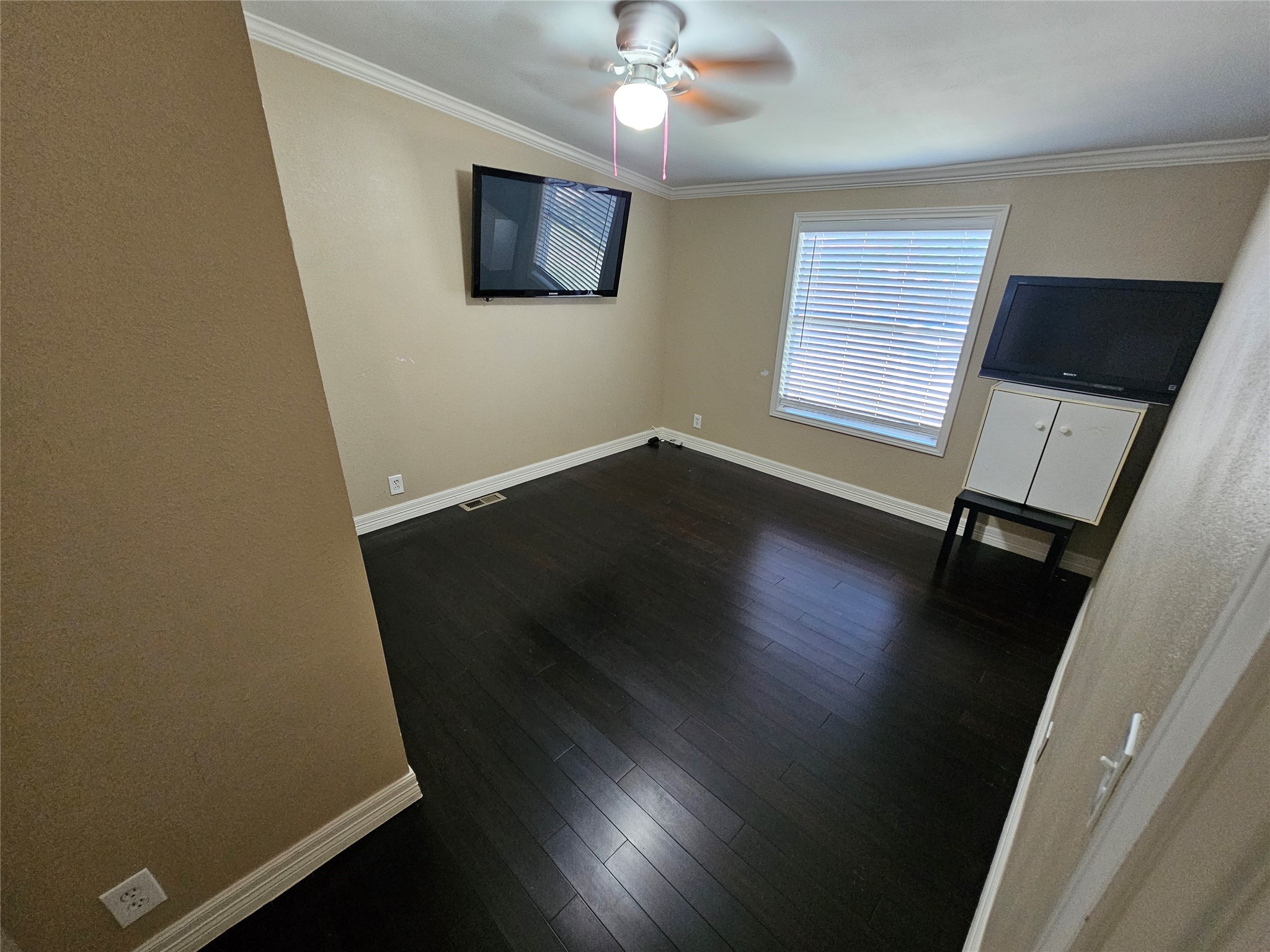 16313 Sandy View Drive Conroe, TX 77303 - Photo 31 of 41 wooden floor in an empty room with a window