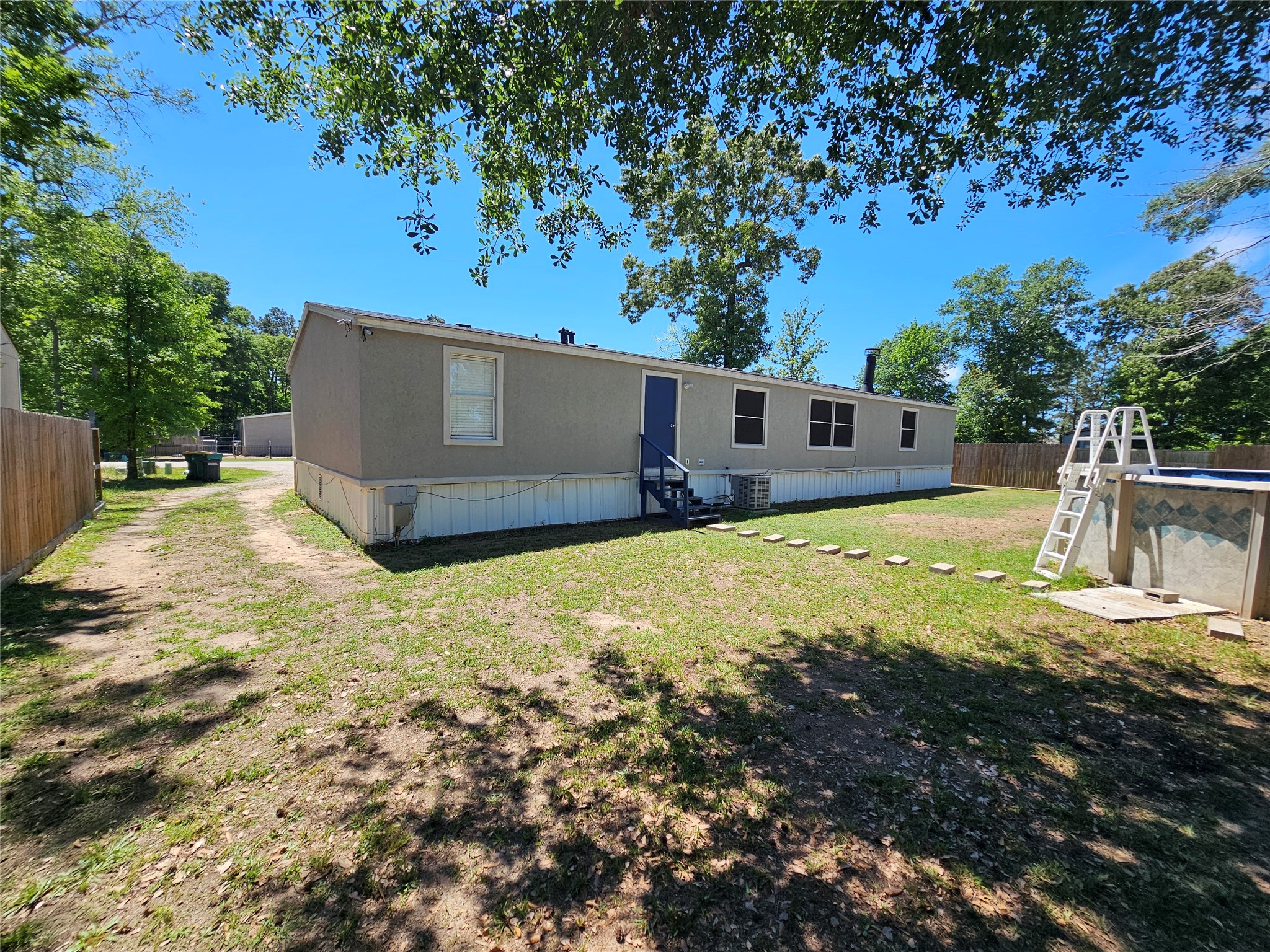 16313 Sandy View Drive Conroe, TX 77303 - Photo 35 of 41 a view of a house with a yard