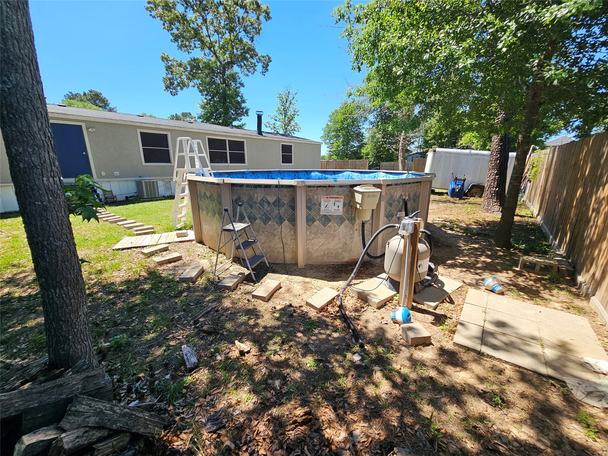 16313 Sandy View Drive Conroe, TX 77303 - Photo 36 of 41 a view of a house with backyard outdoor seating area