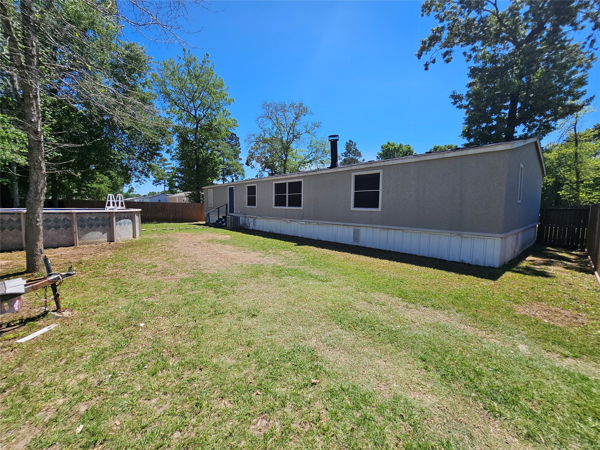 16313 Sandy View Drive Conroe, TX 77303 - Photo 40 of 41 a view of a backyard with a house