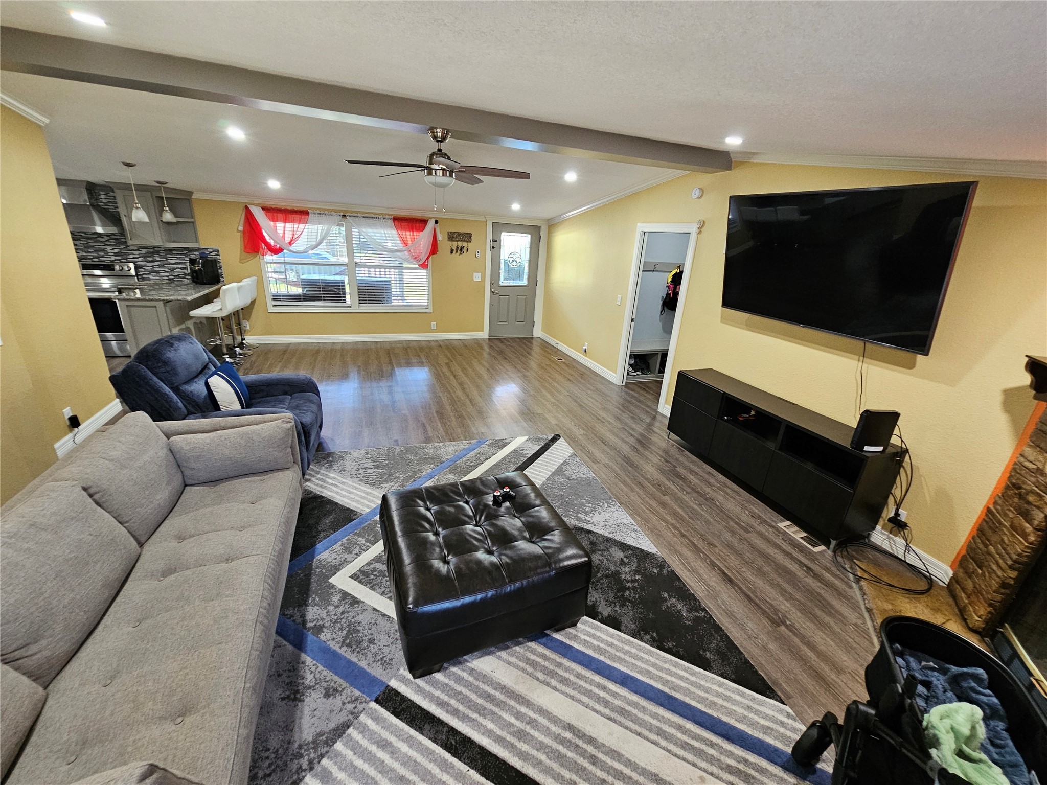 16313 Sandy View Drive Conroe, TX 77303 - Photo 9 of 41 a living room with furniture and a flat screen tv