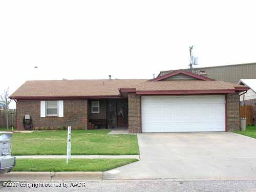 5110 McCarty Boulevard Amarillo, TX 79110 - Photo 1 of 1 a front view of a house with a garden and yard