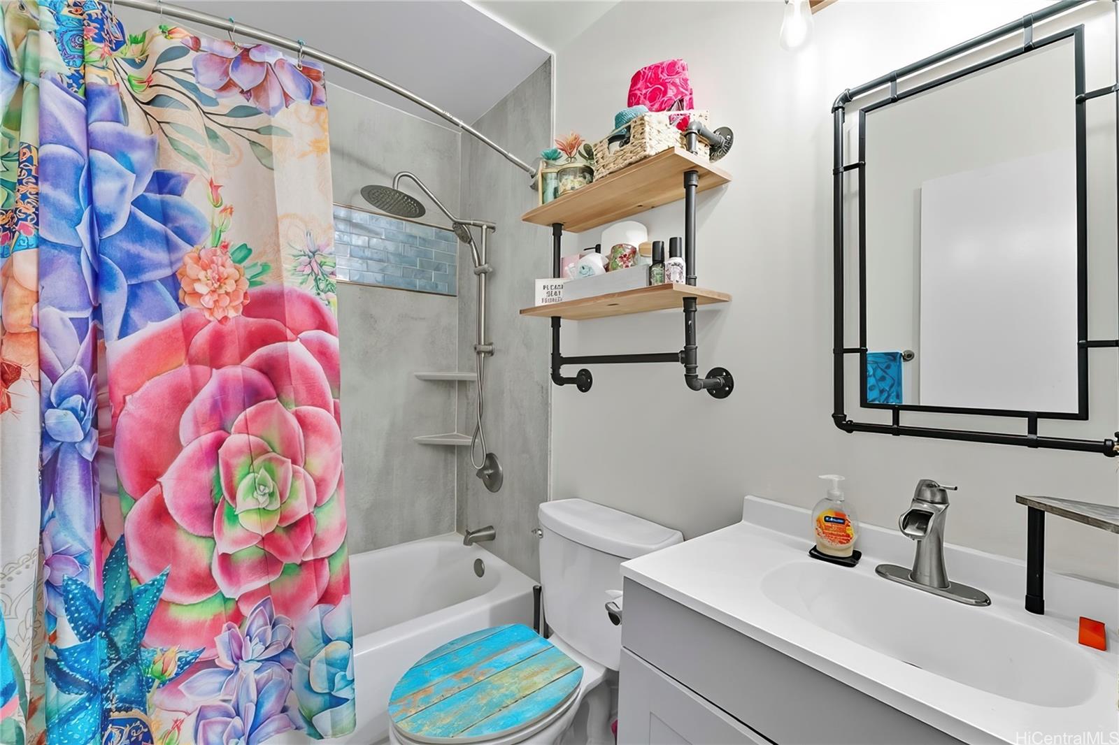 3045 Ala Napuaa Place, Unit 710 Honolulu, HI 96818 - Photo 15 of 25 a bathroom with a sink toilet and shower