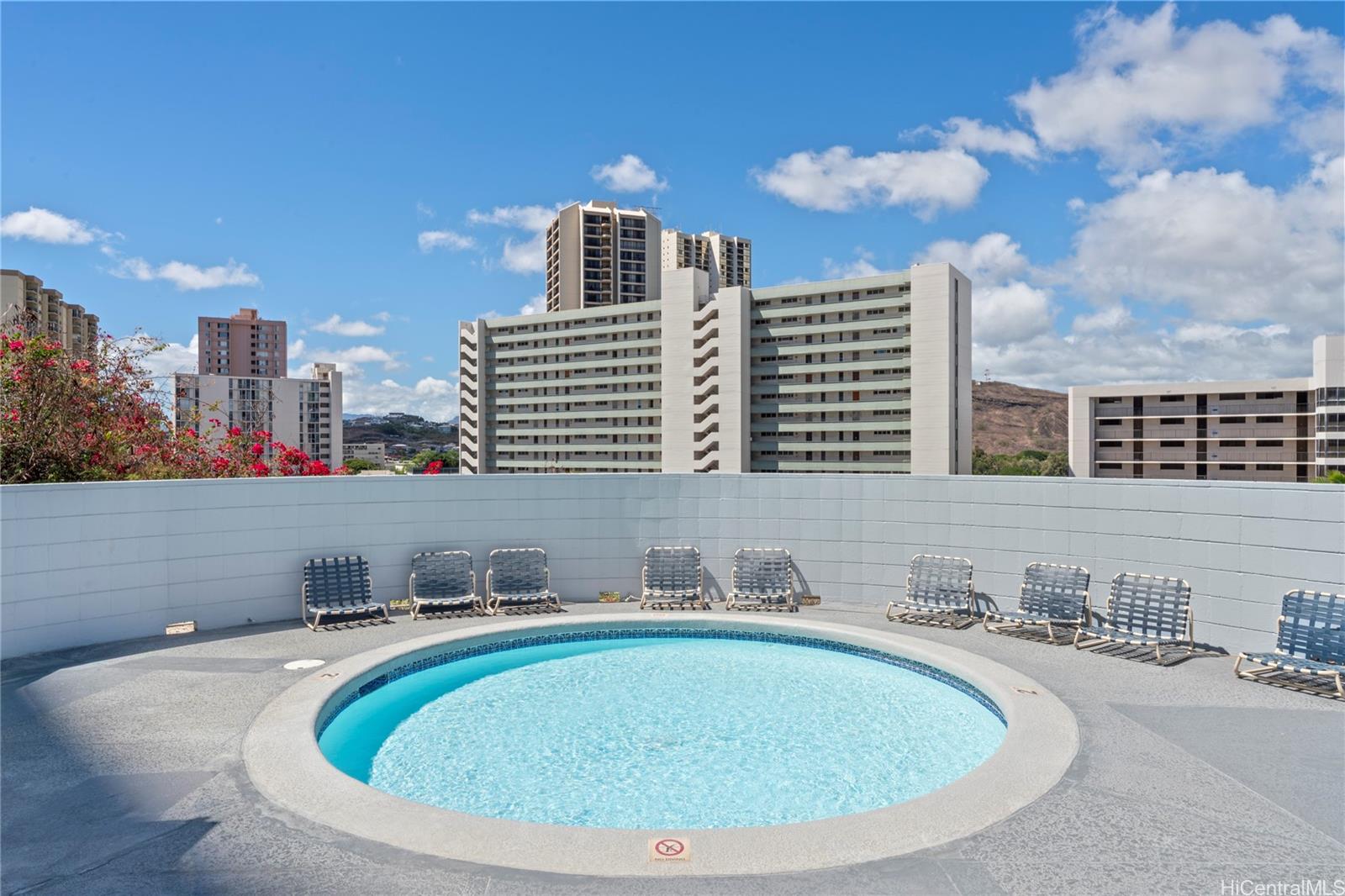3045 Ala Napuaa Place, Unit 710 Honolulu, HI 96818 - Photo 20 of 25 a view of a house with a swimming pool