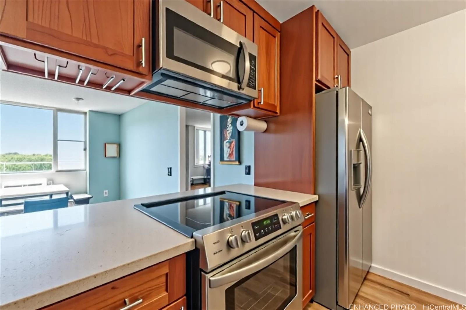 3045 Ala Napuaa Place, Unit 710 Honolulu, HI 96818 - Photo 9 of 25 a kitchen with a sink cabinets and stainless steel appliances