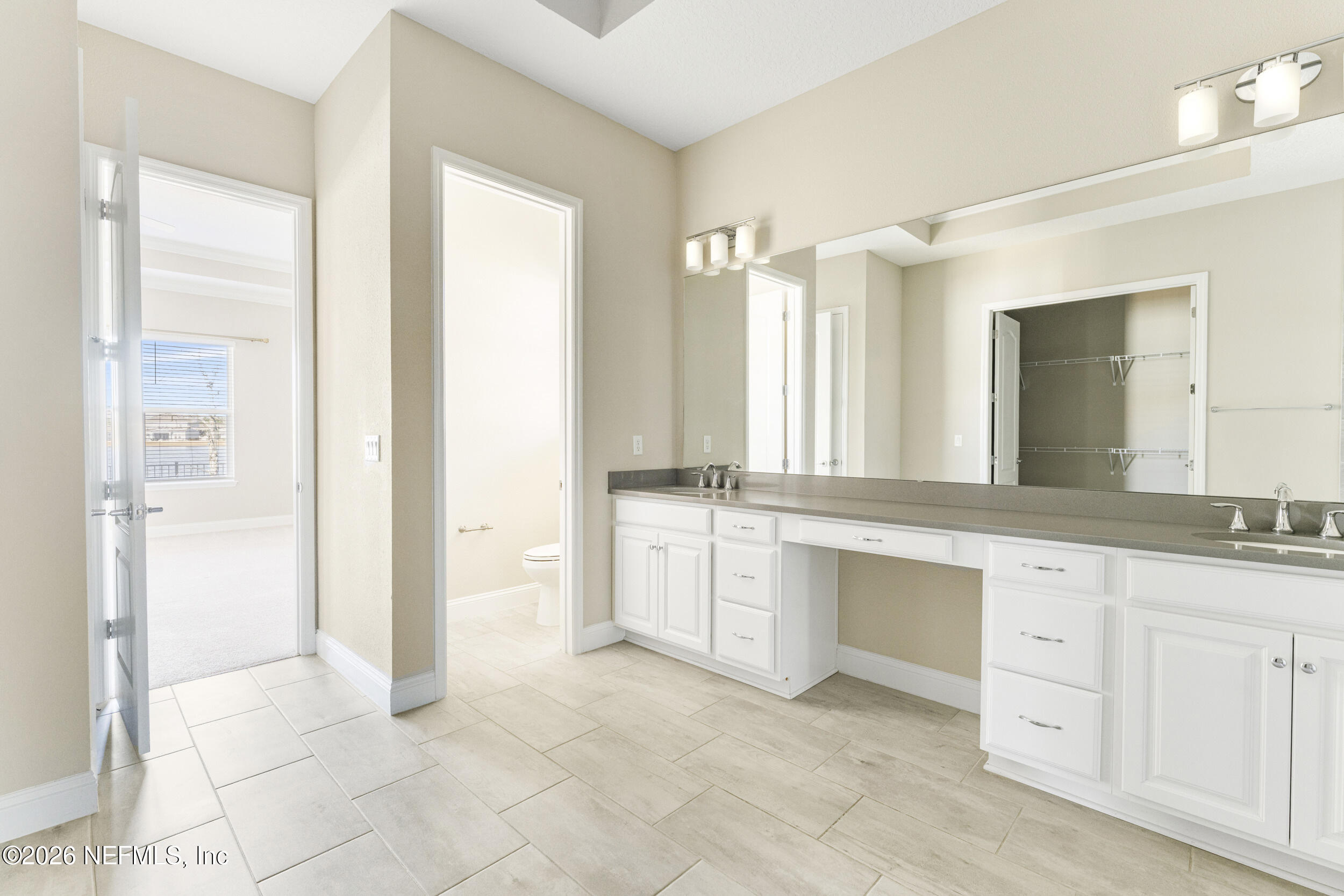 151 Calliel Way St. Johns, FL 32259 - Photo 14 of 35 a spacious bathroom with a granite countertop sink a mirror and a vanity
