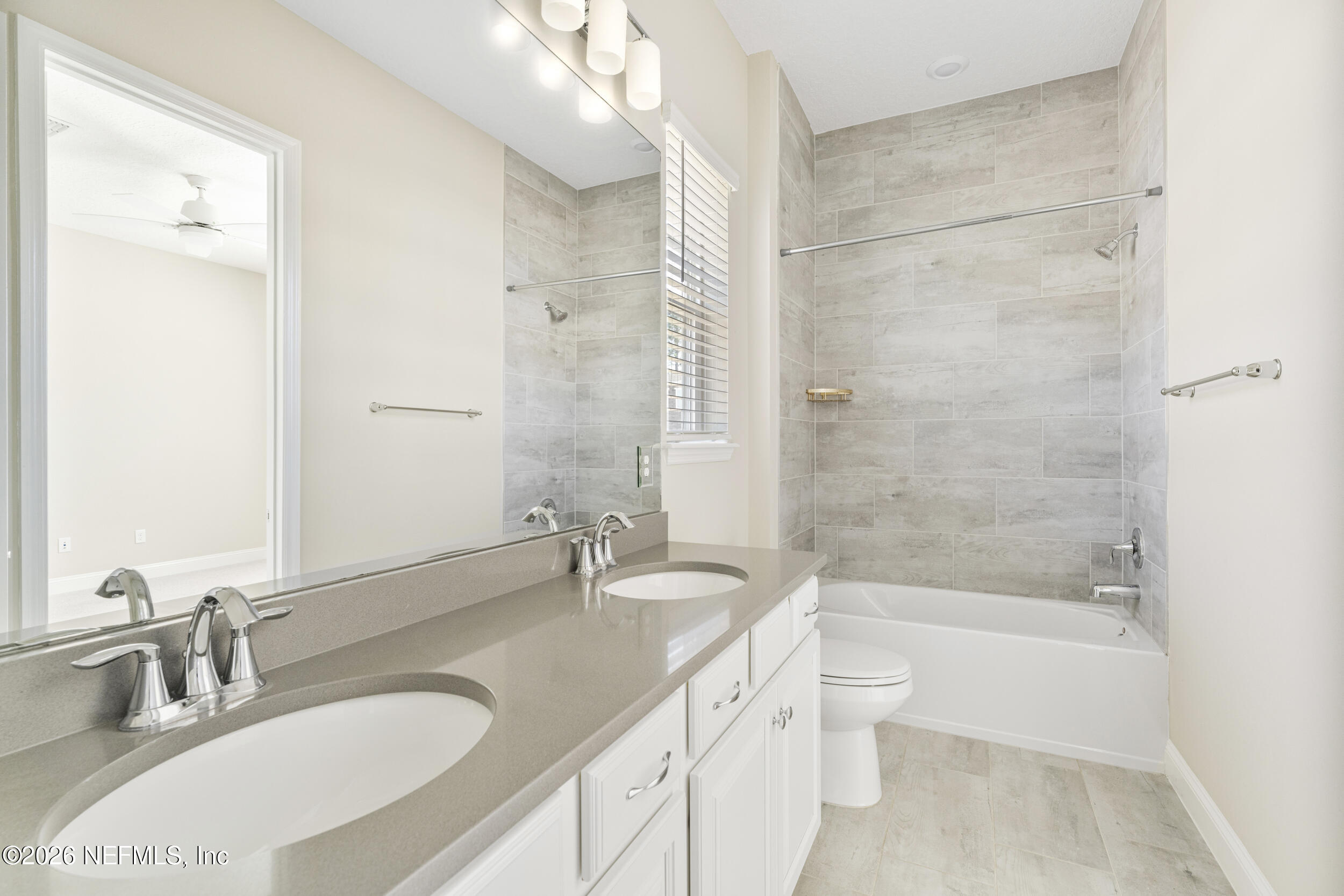 151 Calliel Way St. Johns, FL 32259 - Photo 21 of 35 a bathroom with a granite countertop sink a toilet and bathtub