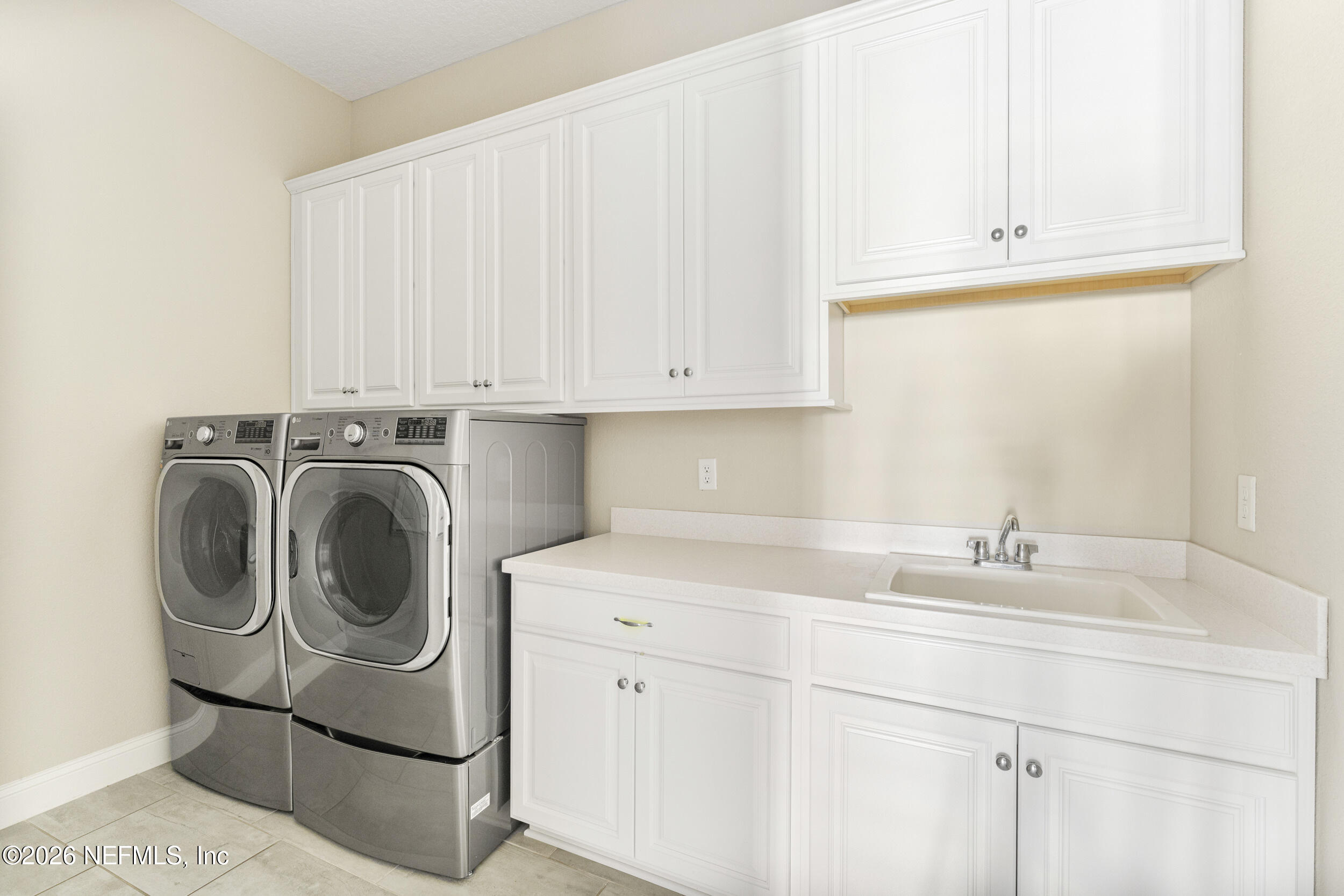 151 Calliel Way St. Johns, FL 32259 - Photo 28 of 35 a utility room with sink dryer and washer