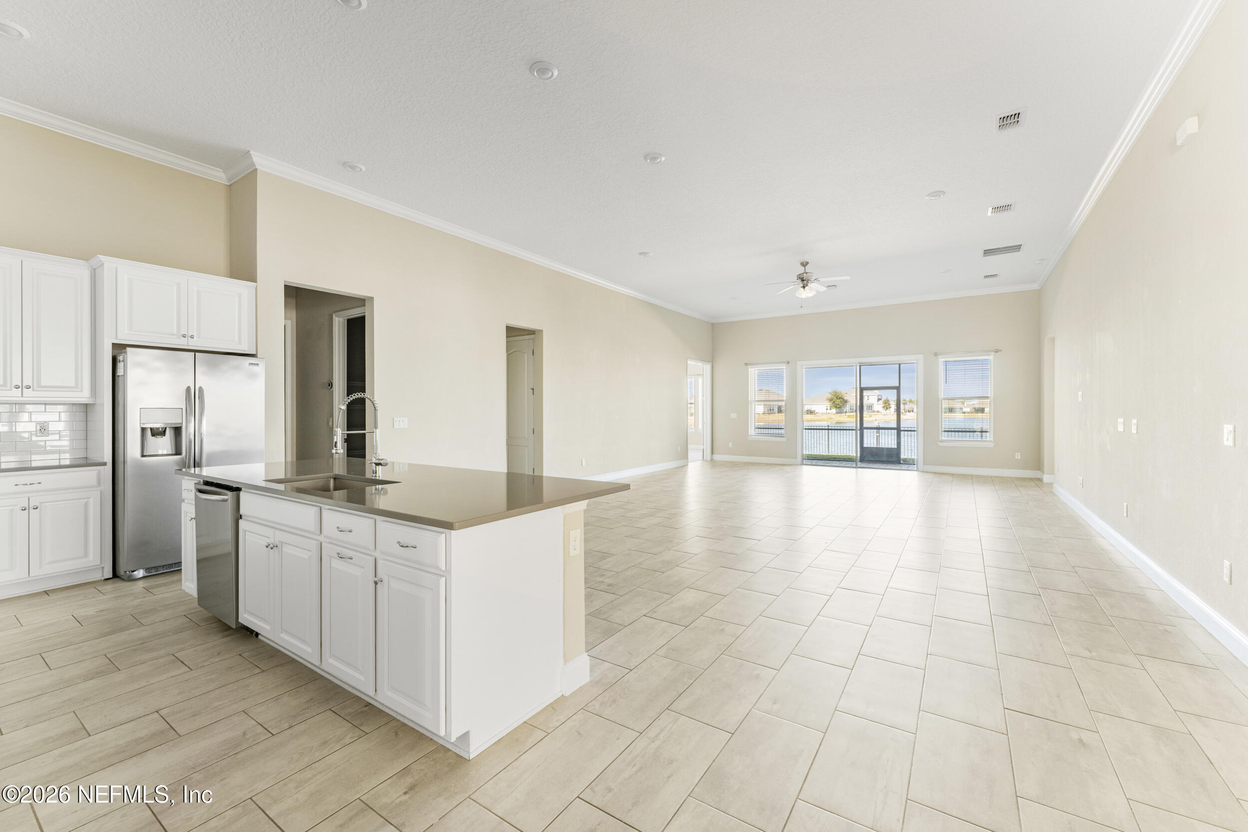 151 Calliel Way St. Johns, FL 32259 - Photo 4 of 35 a kitchen with stainless steel appliances granite countertop a refrigerator and a stove top oven