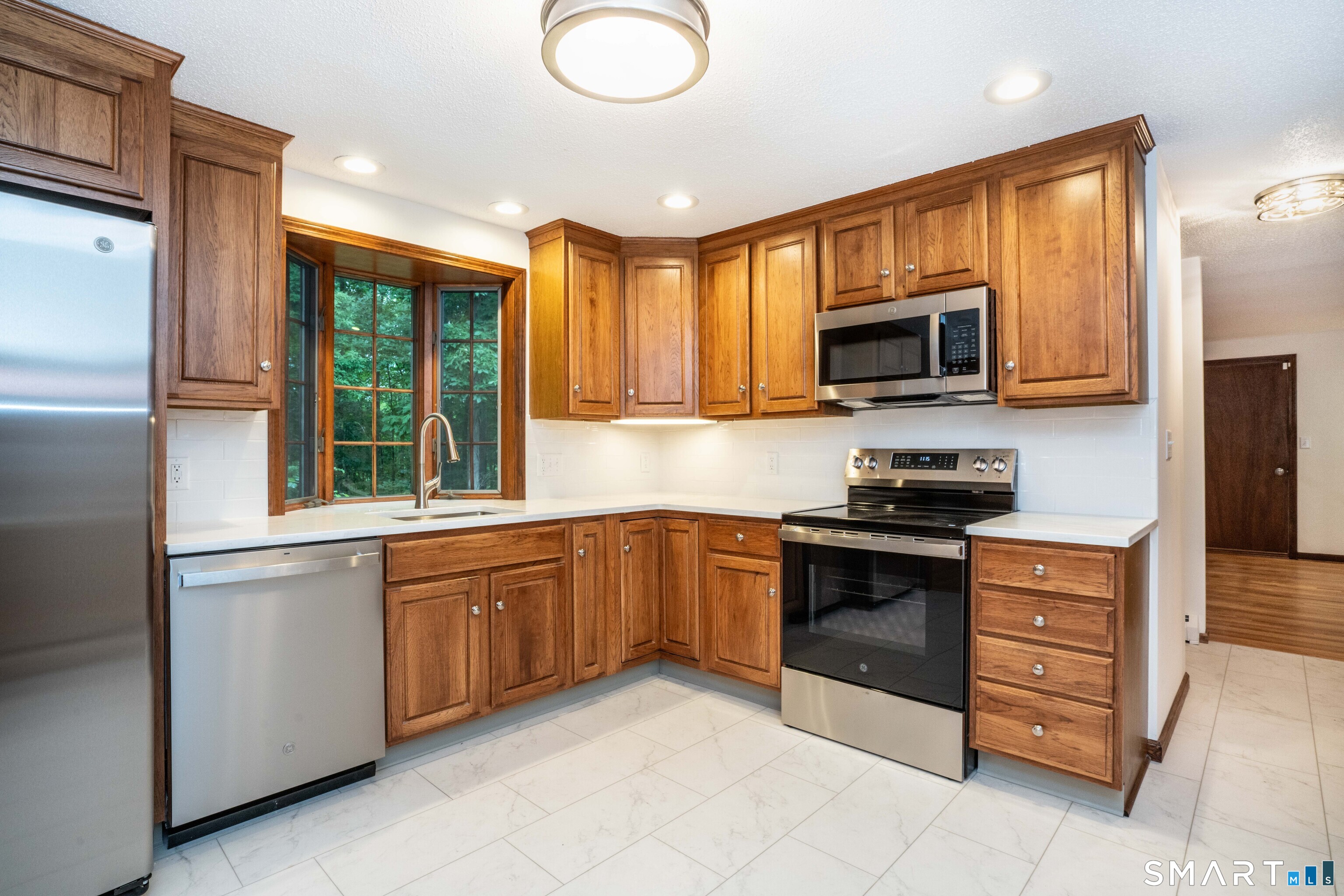 182 Valley View Road Manchester, CT 06040 - Photo 10 of 40 Additional view of kitchen with bay window.