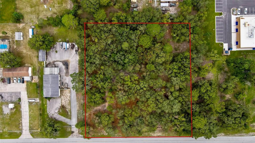 0 Old Shady Hills Road Spring Hill, FL 34610 - Photo 1 of 17 an aerial view of residential houses with outdoor space