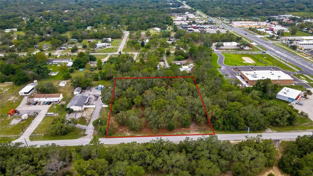 0 Old Shady Hills Road Spring Hill, FL 34610 - Photo 2 of 17 an aerial view of residential houses with outdoor space and trees