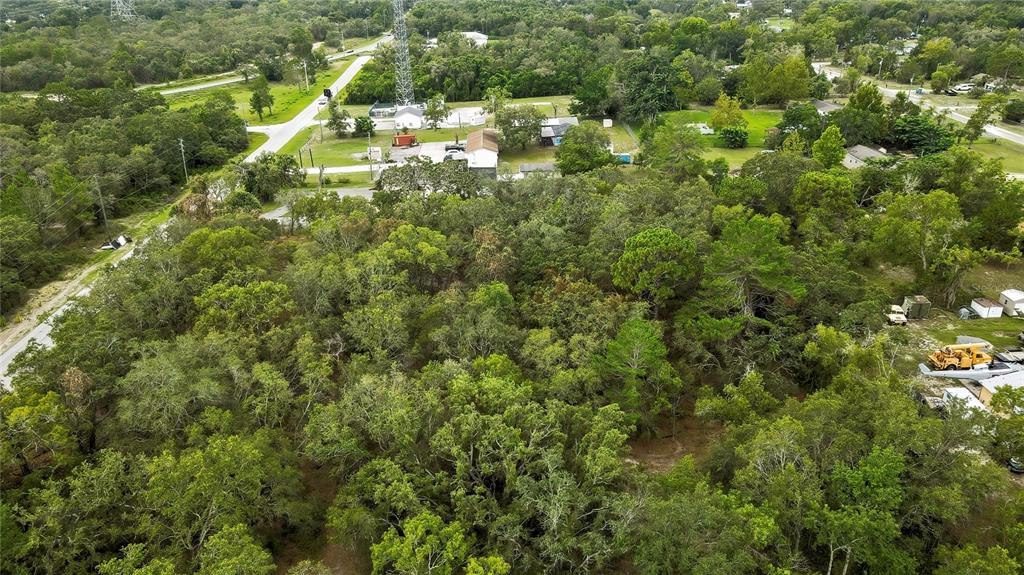 0 Old Shady Hills Road Spring Hill, FL 34610 - Photo 10 of 17 a view of a house with a lush green forest