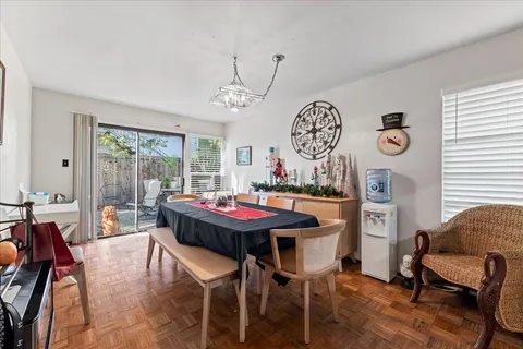 a kitchen with stainless steel appliances a refrigerator and a wooden cabinets