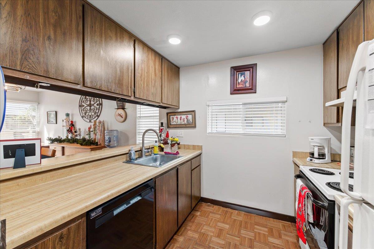 552 Walnut Street San Carlos, CA 94070 - Photo 13 of 27 a kitchen with stainless steel appliances granite countertop a sink stove and cabinets