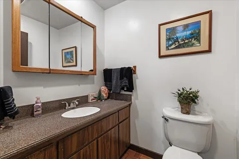 a bedroom with bed and a mirror