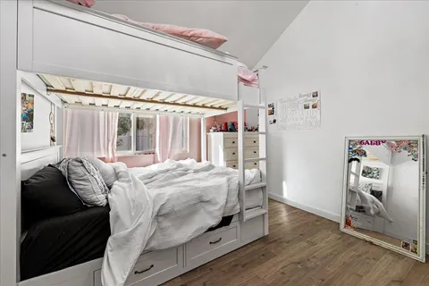 a white toilet sitting next to a shower curtain