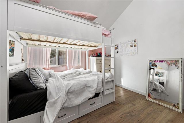 a white toilet sitting next to a shower curtain