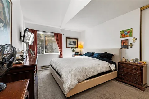 a bedroom with a bed and furniture