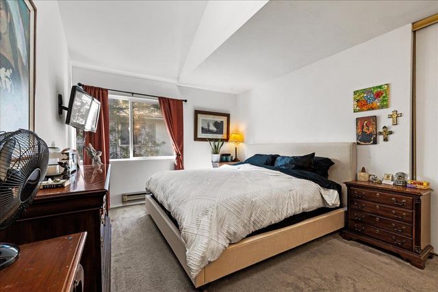 a bedroom with a bed and furniture