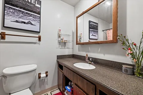 a bathroom with a sink double vanity and a mirror