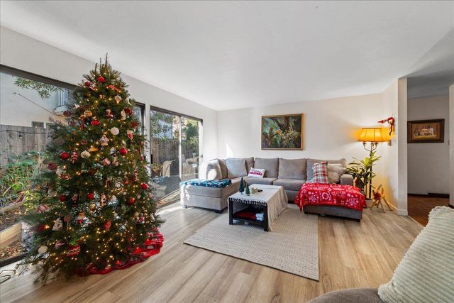 a view of a patio with table and chairs and potted plants