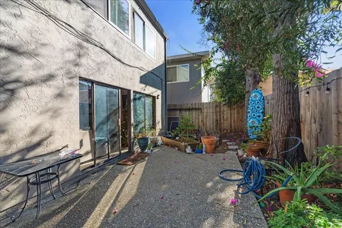 a view of a dining room with furniture and kitchen view