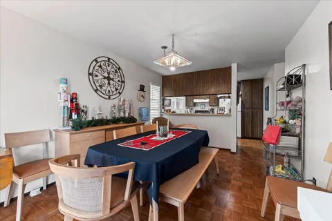 a view of a dining room with furniture window and outside view