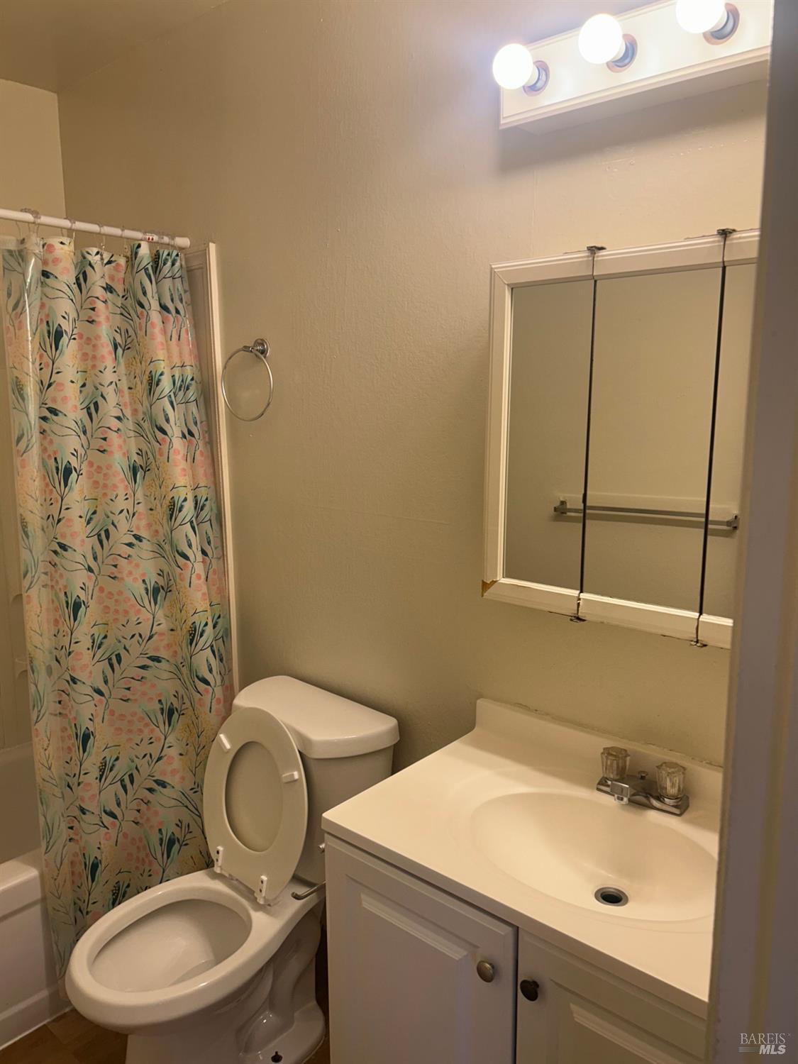 1955 Grande Circle, Unit E Fairfield, CA 94533 - Photo 8 of 9 a bathroom with a sink a toilet and shower