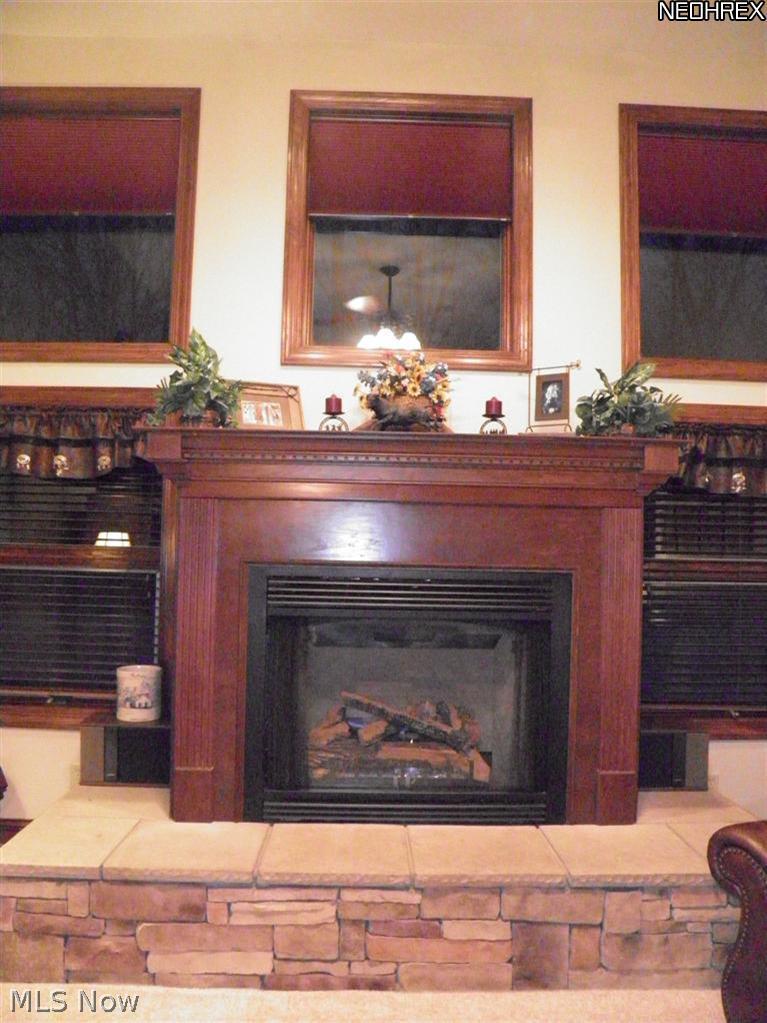 8664 Infirmary Road Ravenna, OH 44266 - Photo 9 of 25 Beautiful Stone Hearth and Custom Gas Fireplace