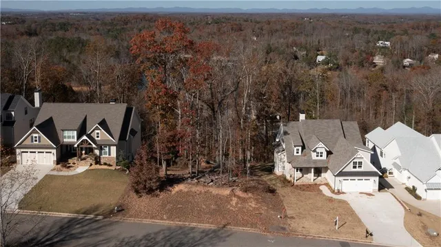an aerial view of a house with garden space and sitting space