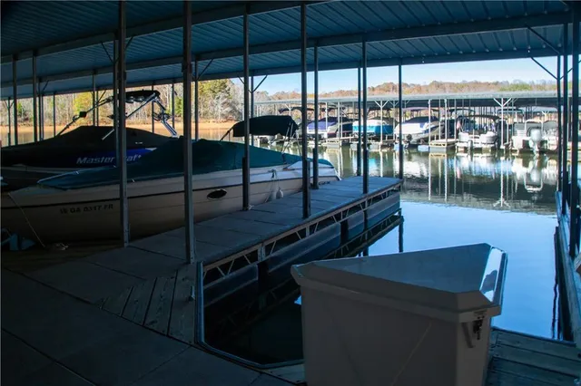 a dinning table sitting next to a lake