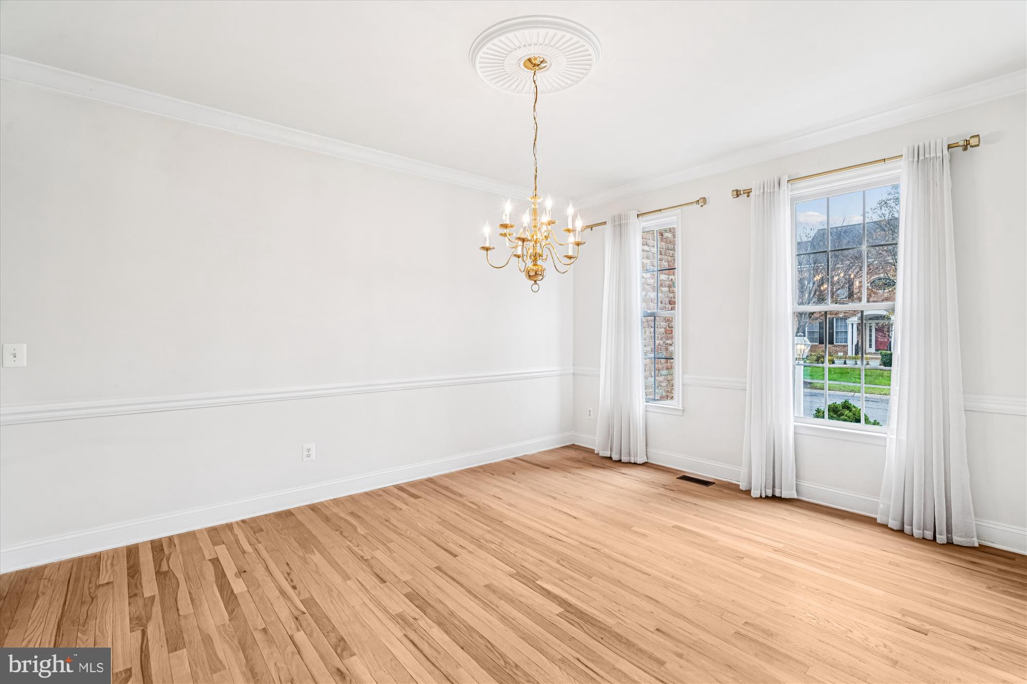 206 Heatherbloom Trail Gambrills, MD 21054 - Photo 11 of 46 a view of a room with wooden floor and natural light