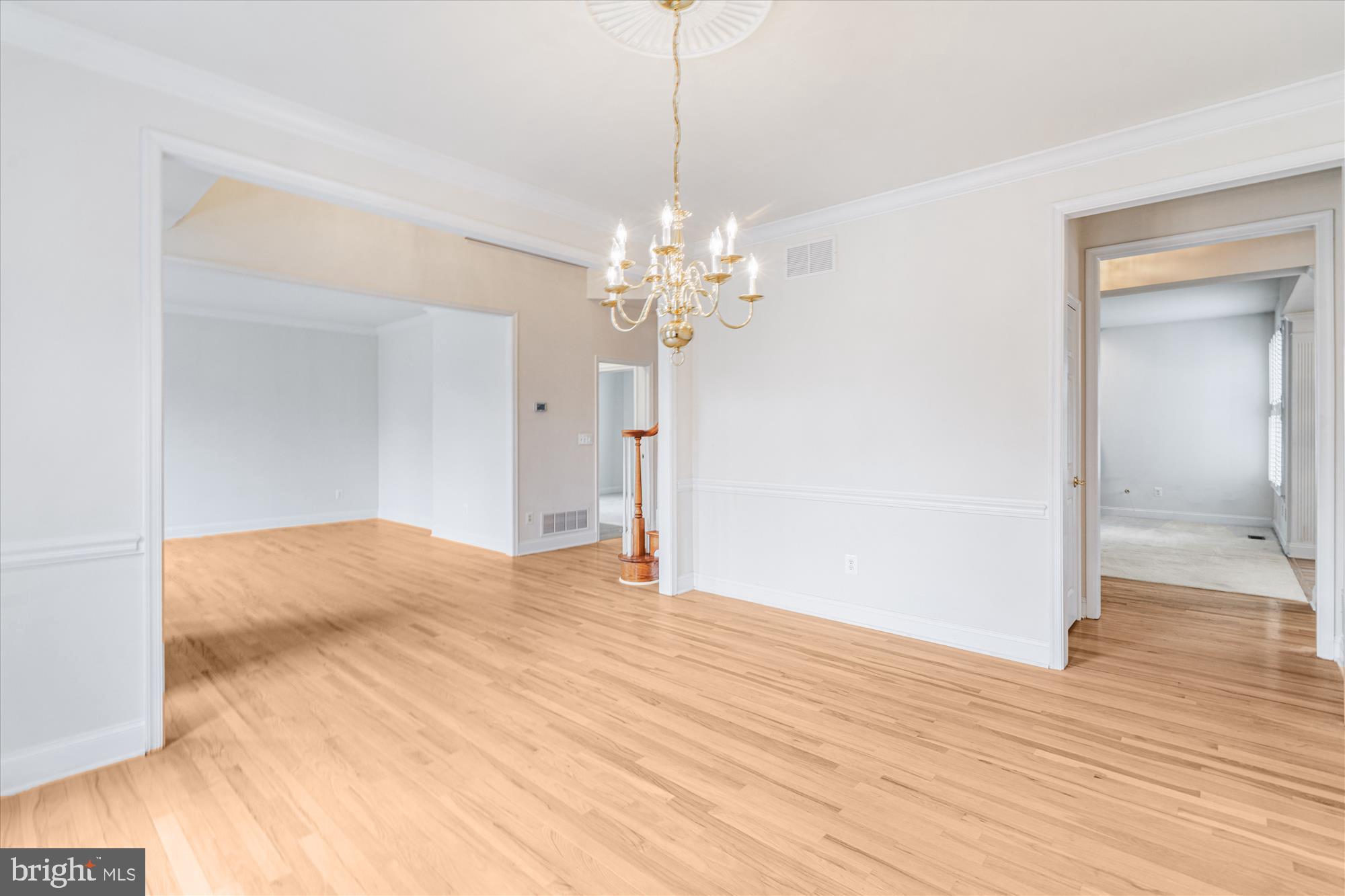 206 Heatherbloom Trail Gambrills, MD 21054 - Photo 12 of 46 a view of a room with wooden floor and chandelier