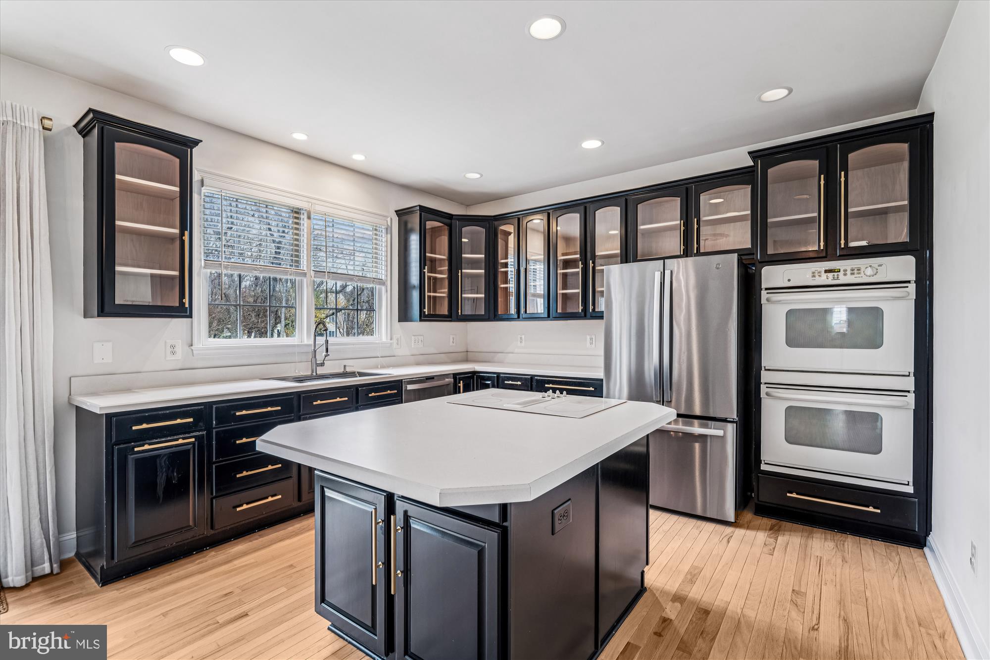 206 Heatherbloom Trail Gambrills, MD 21054 - Photo 13 of 46 a kitchen with a stove a sink and a refrigerator