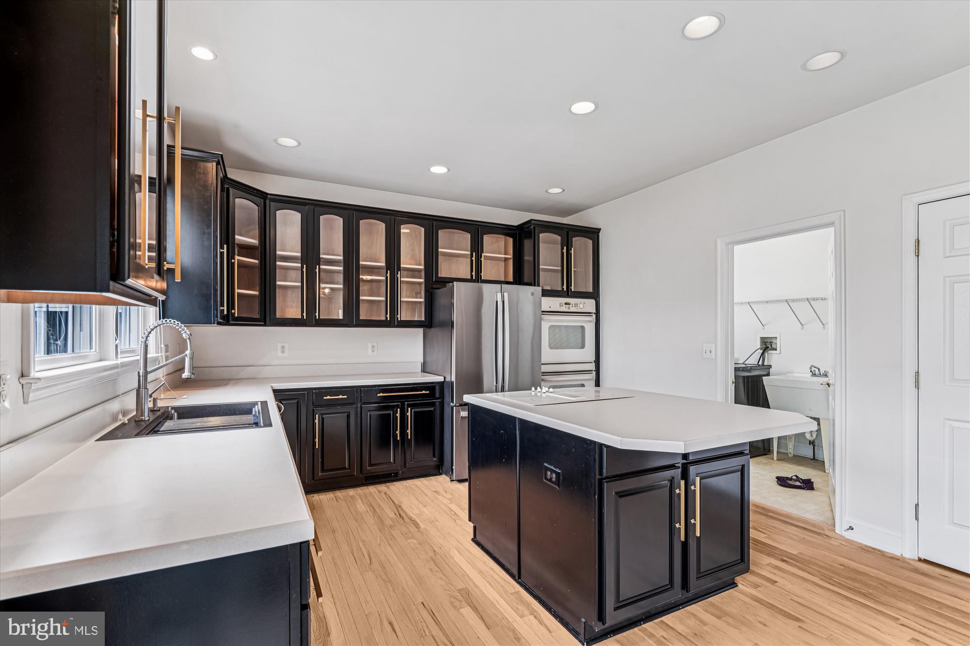 206 Heatherbloom Trail Gambrills, MD 21054 - Photo 14 of 46 a kitchen with stainless steel appliances granite countertop a stove and a sink