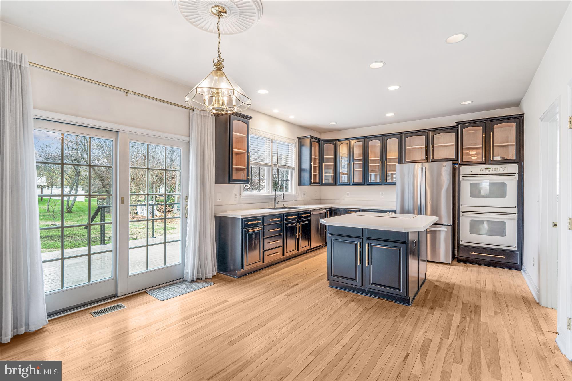 206 Heatherbloom Trail Gambrills, MD 21054 - Photo 15 of 46 a open kitchen with stainless steel appliances granite countertop a stove and a wooden floors