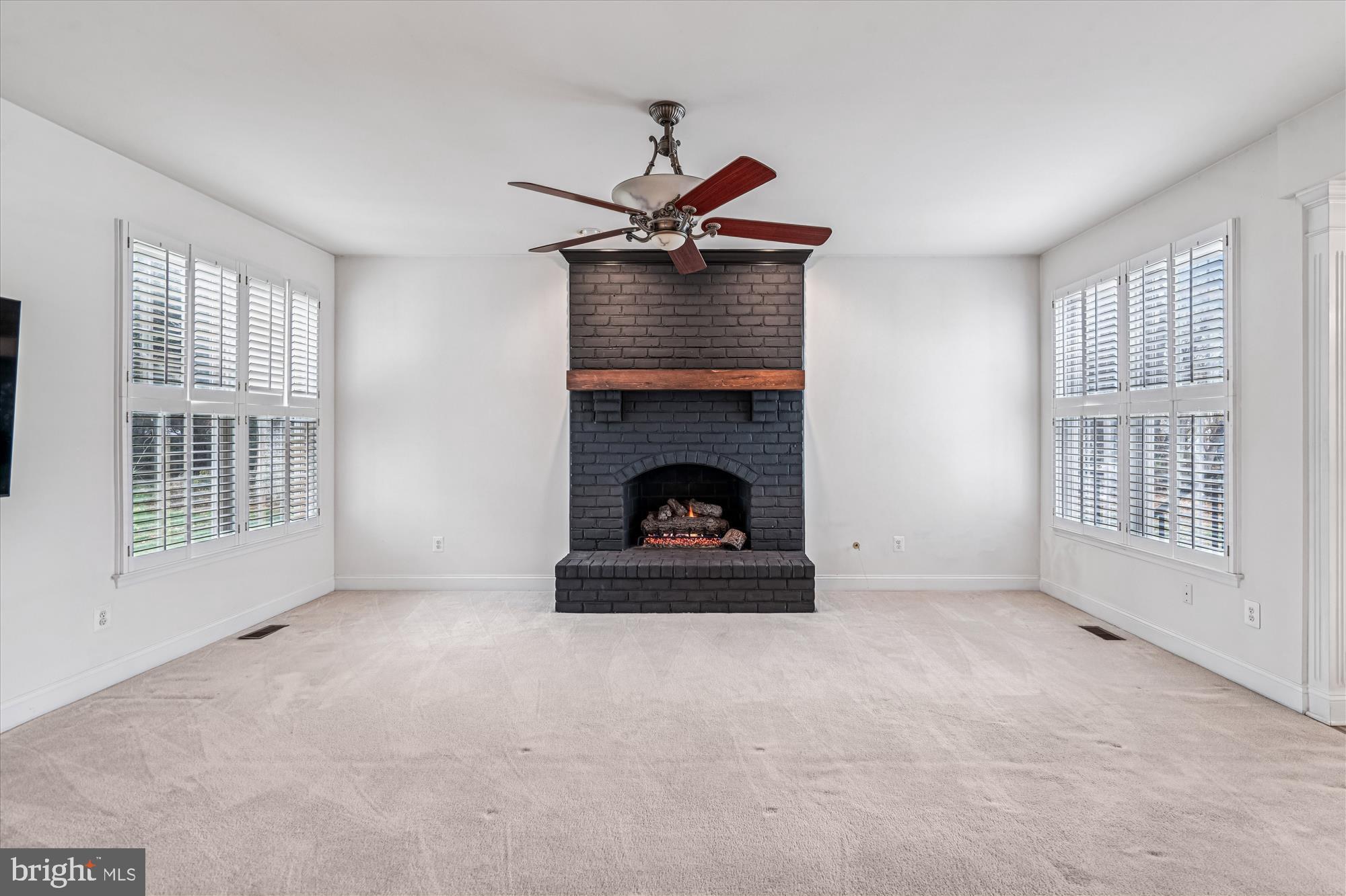206 Heatherbloom Trail Gambrills, MD 21054 - Photo 17 of 46 a living room with furniture and a fireplace