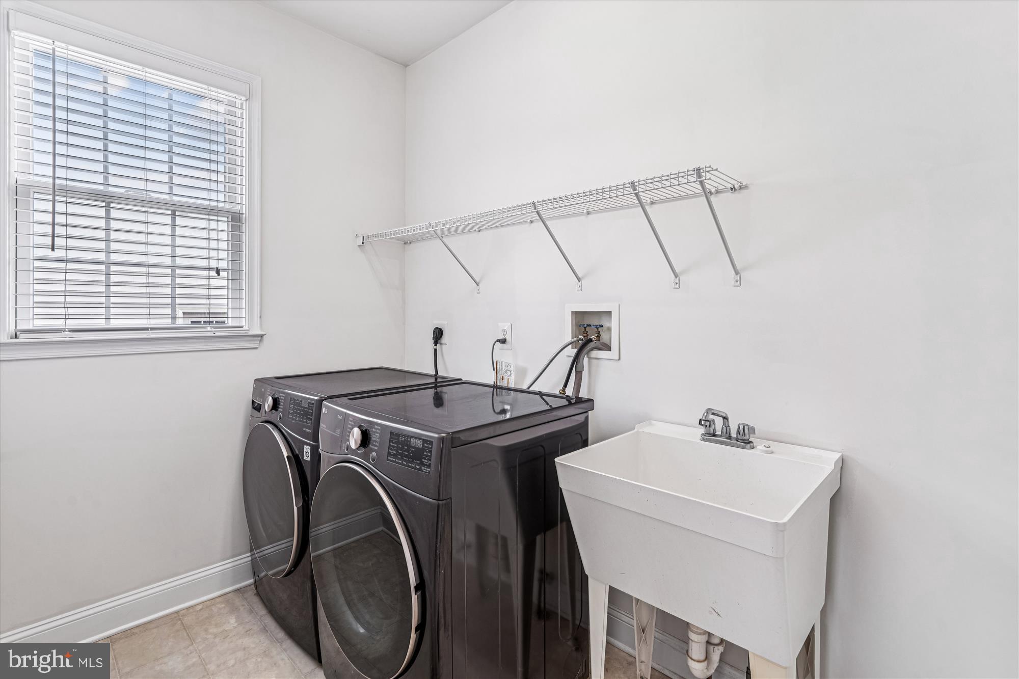 206 Heatherbloom Trail Gambrills, MD 21054 - Photo 21 of 46 a utility room with dryer and washer
