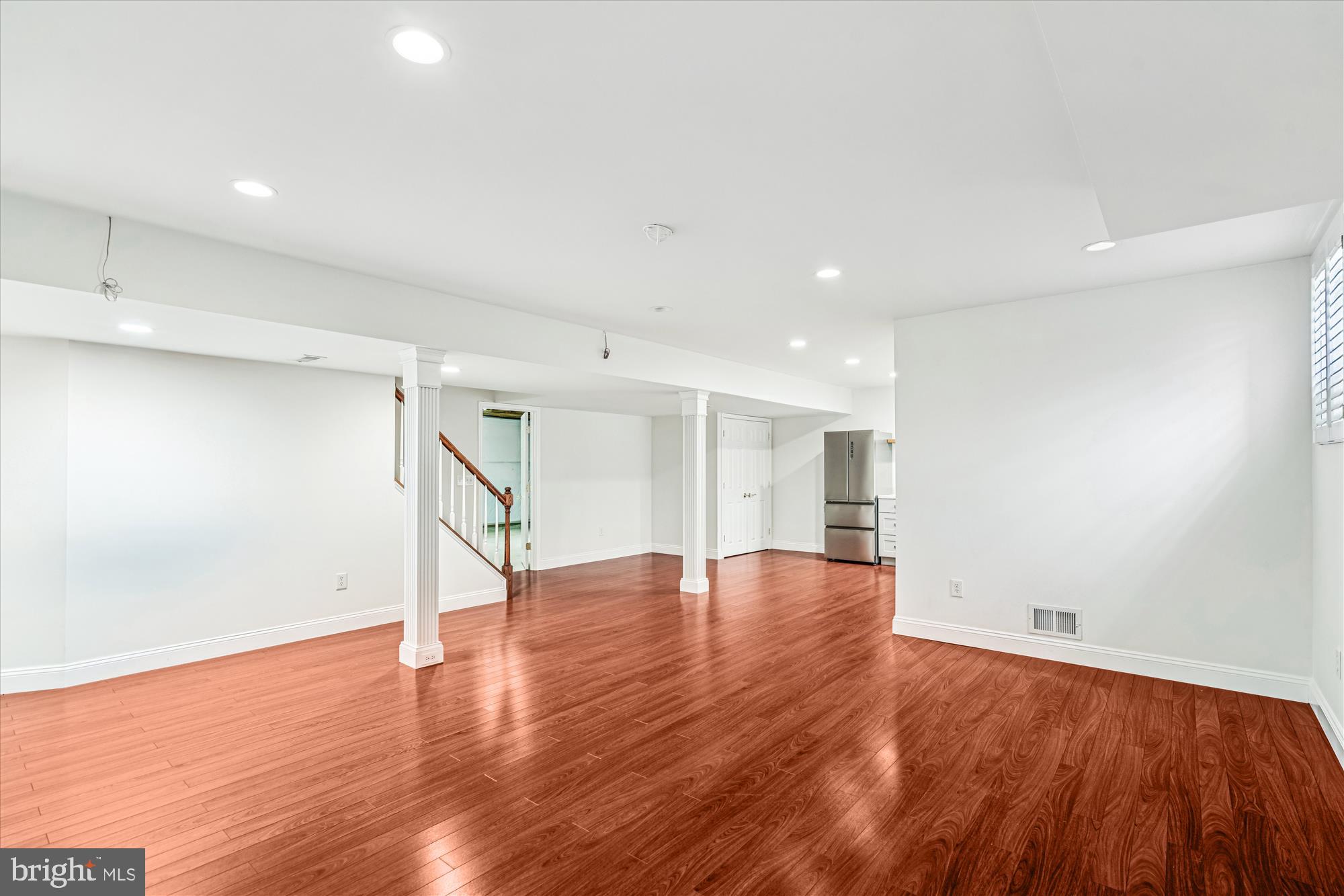 206 Heatherbloom Trail Gambrills, MD 21054 - Photo 36 of 46 an empty room with wooden floor and windows