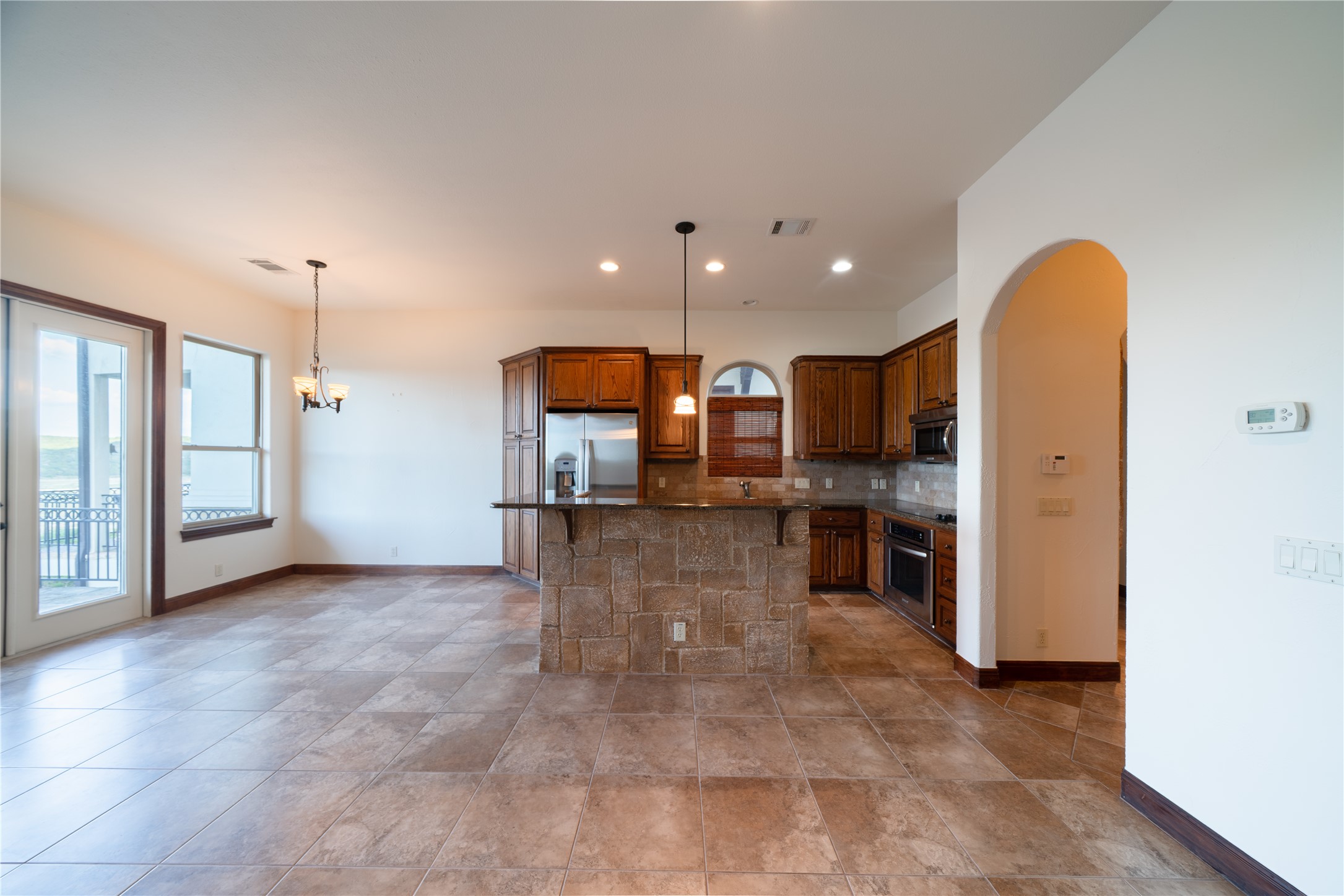 17545 West Reed Park Road, Unit 2 Jonestown, TX 78645 - Photo 7 of 39 a view of a kitchen with a sink and cabinets