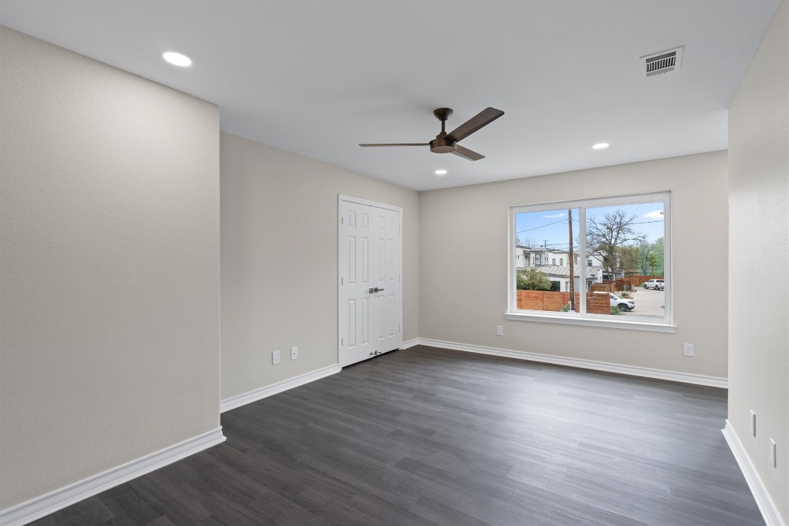 1209 Casey Street, Unit A Austin, TX 78745 - Photo 11 of 14 a view of an empty room with wooden floor and a window